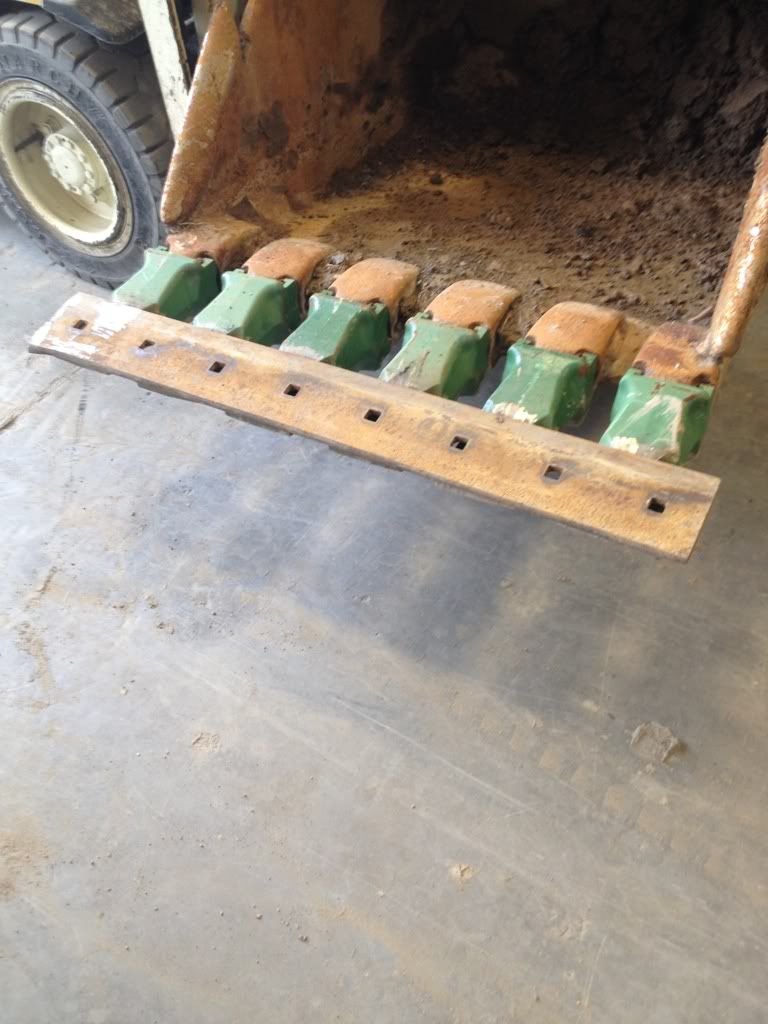 A little painting and some welding on brand new bucket teeth